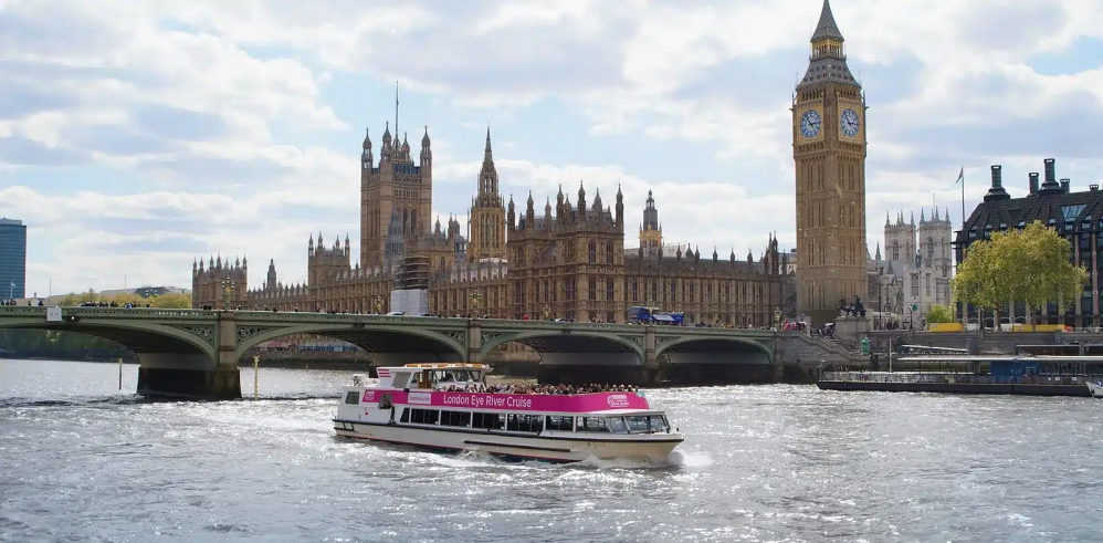 Boat on River Thames with Big Ben and Westminster in background.